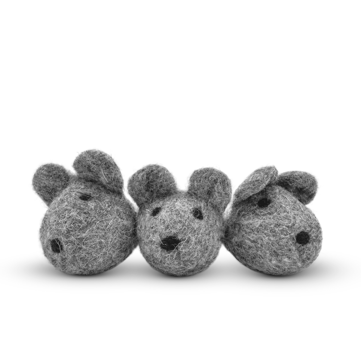 White felted wool mice cat toy on a light background.