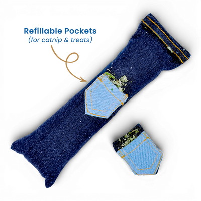 Denim cat kicker toy with matching pocket toy and an arrow highlighting the refillable catnip pockets on a light background.