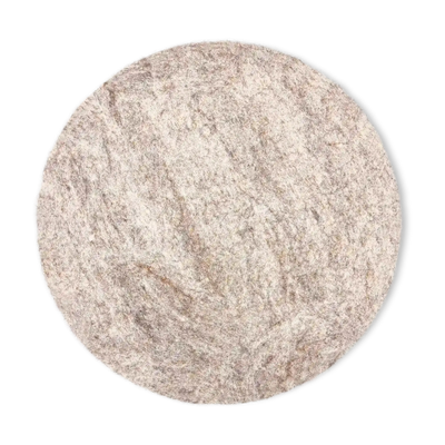 Top view of a round light brown felted wool cat bed on a white background.