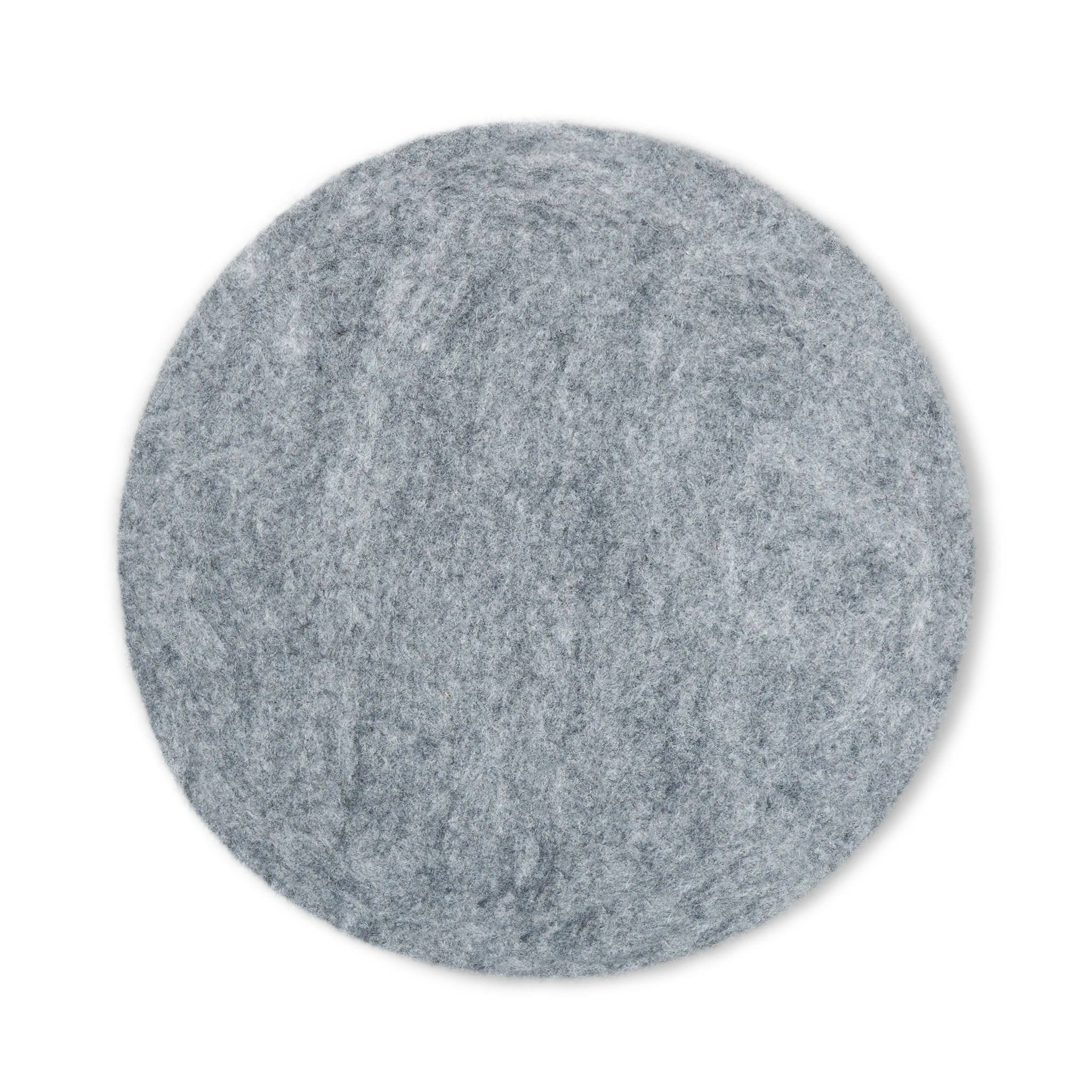 Top view of a round light gray felted wool cat bed on a white background.