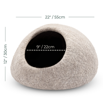 A felt cat bed or cozy dome-shaped pet house in a light warm gray-beige color, shown on a white background with overlaid dimension lines and text indicating 22 inches wide by 12 inches high.