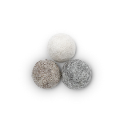 Three textured wool felt cat toy balls in off-white, light brown, and light gray, arranged in a triangle on a white background.