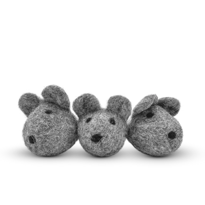 White felted wool mice cat toy on a light background.