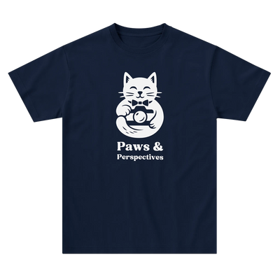 Navy blue Paws & Perspectives cat graphic t-shirt laid flat on a light background.