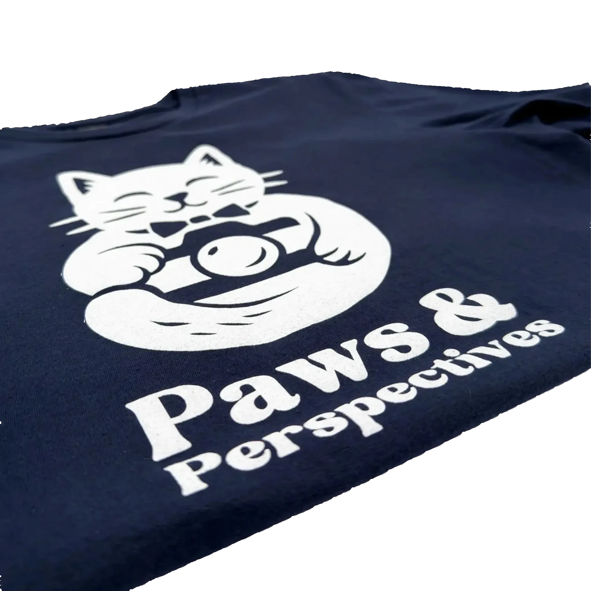 Close-upa angled photo of the white Paws & Perspectives cat graphic printed on a navy blue t-shirt on a light background.